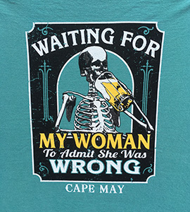 A skeleton drinking a beer. Text: Waiting for my woman to admit she was wrong. Cape May